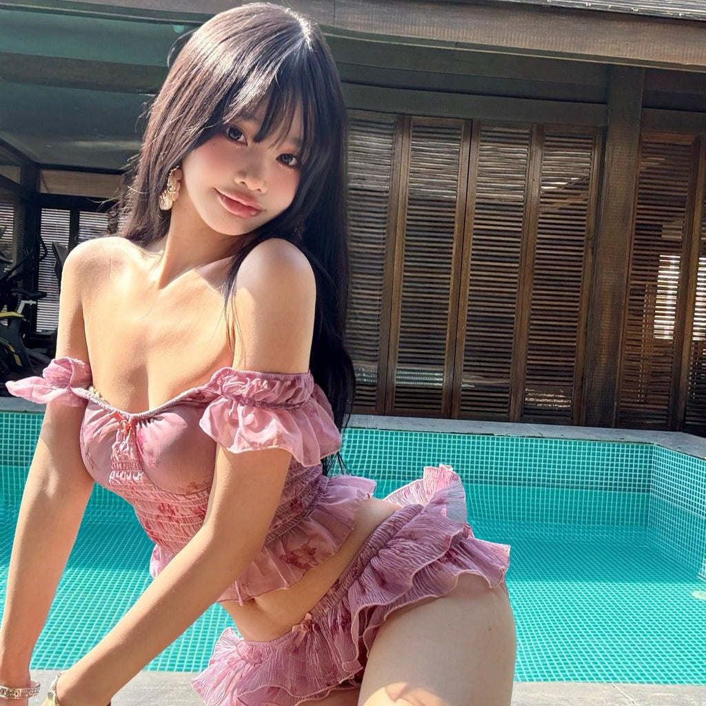 Pink ruffled off-shoulder swimsuit by poolside, trendy summer fashion