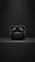 Matte black earbuds with gold accents